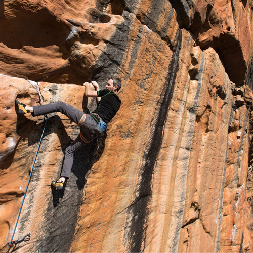 Rock climber wearing Wilderness Wear MerinoFusion 160 Base Layer